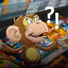 Das Foto zeigt eine Regal mit Schokoladenprodukten - hinzugefügt im Comic-Stil ü- ein Affe mit einem Frage- und einem Ausrufezeichen über dem Kopf.